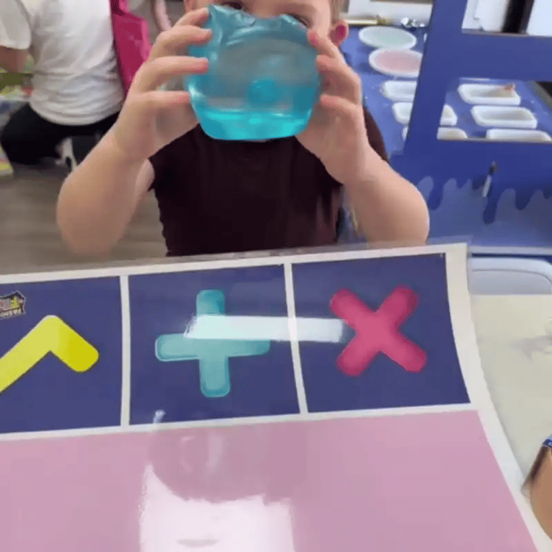 Kids showing off squishy toys to friends at school