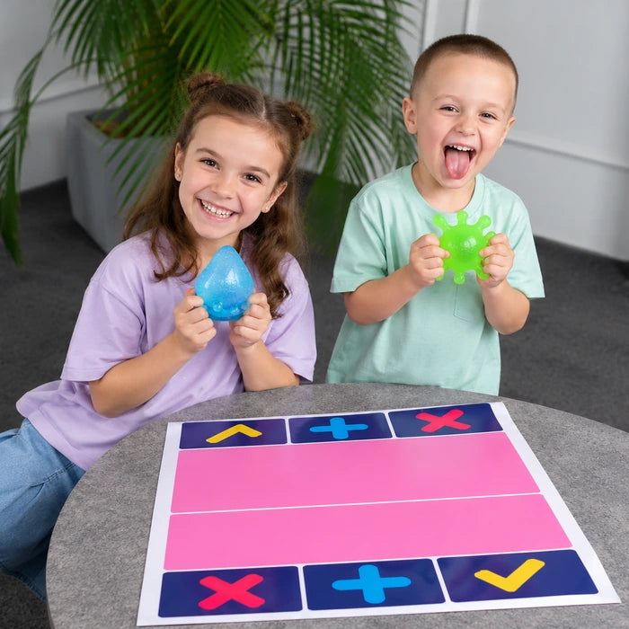 Two kids negotiating a trade, one holding a trading mat